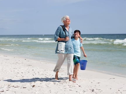 Woman walking on the beach with Caire FreeStyle Comfort.