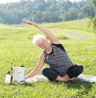 Woman exercising with Caire FreeStyle Comfort.