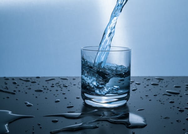 Water being poured into a glass.