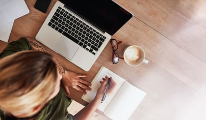 Woman creating a list.