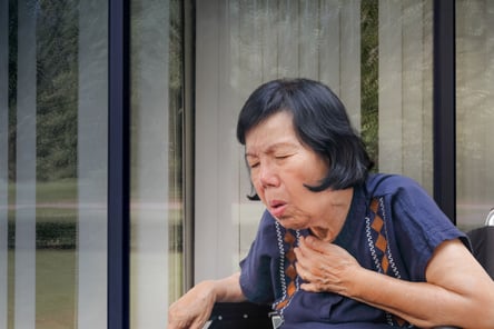 Woman coughing