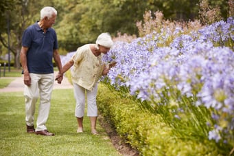 Man and woman walking in the park.