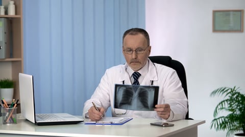 Doctor examining chest x-ray