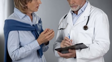 Woman speaking with doctor