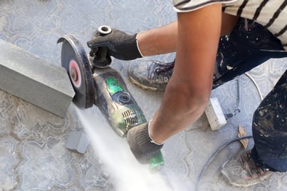 Man using an electric saw.