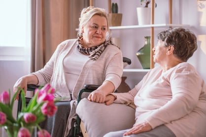 Elderly woman speaking with her friend