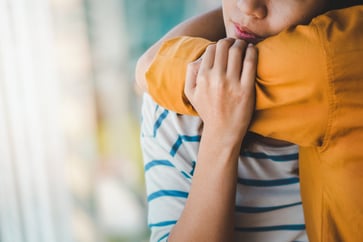 Two women hugging