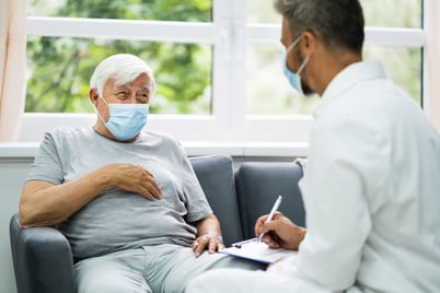 Man speaking with doctor