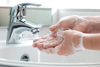 Washing hands in a sink