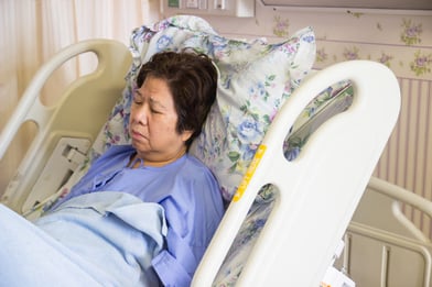 Woman in hospital bed