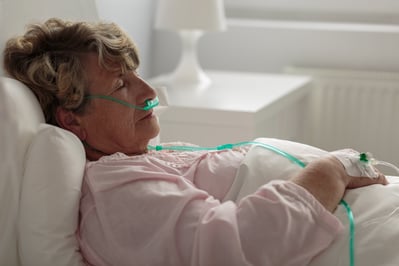 Woman with nasal cannula.