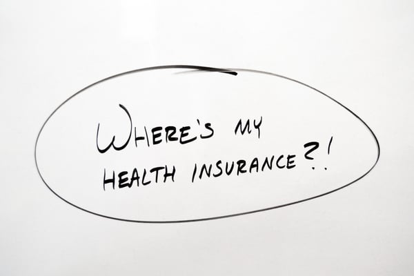 Whiteboard that says "where's my health insurance?"