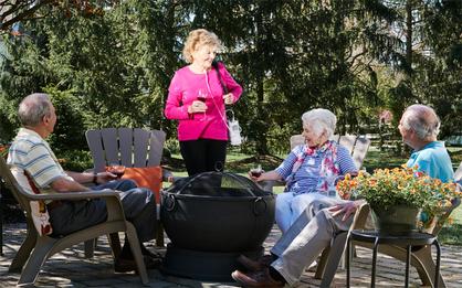 Lady with G4 speaking with her friends.