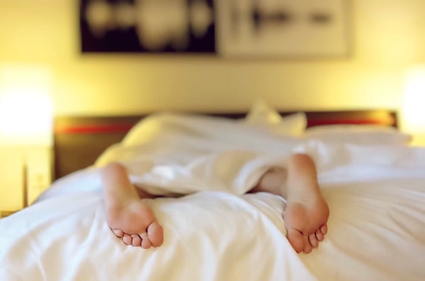 Sleeping person on a bed.