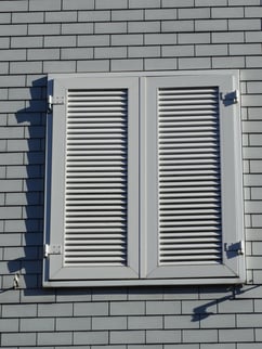 Window with shutters closed.