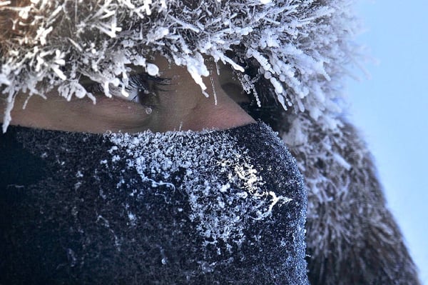 Woman standing in the cold.