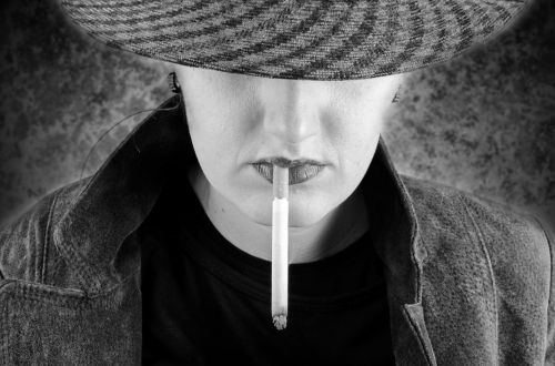 woman-smokes-a-cigarette-1387640353R5m